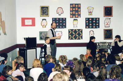 Magician Peter Mennie Performs for a Group of Children at the Brantford Public Library