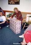 Brantford Public Library Staff Member Susan Vincent Opens a Gift at her Retirement Party