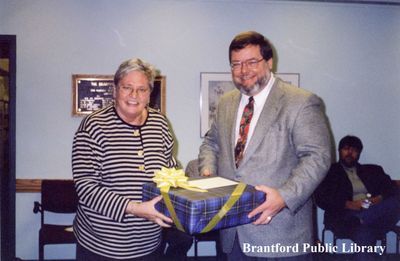 Brantford Public Library Board Member Jo Brennan at her Retirement Party with Jim MacDonald