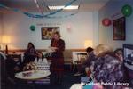 Brantford Public Library Staff Member Susan Vincent Opens a Gift at her Retirement Party