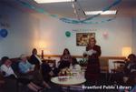 Brantford Public Library Staff Member Susan Vincent Reads a Card at her Retirement Party