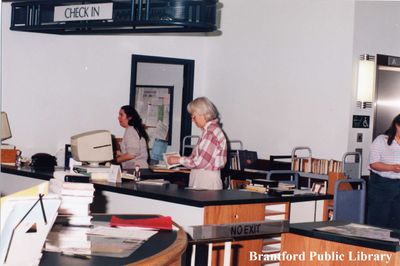 Brantford Public Library Staff Members at the Main Branch Check-In Desk