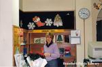 Staff Member at the Brantford Public Library Carnegie Branch Check Out Desk