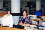 Brantford Public Library Staff Member at the Main Branch Library Desk