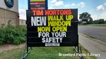 Tim Hortons Sign Reading 'New Walk Up Window Now Open For Your Safety' During the COVID-19 Pandemic