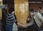 Osijek delegate shakes hands with Brantford resident, October 1981