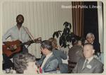 Osijek delegates attend a dinner in Brantford with a live musician, October 1981