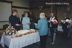 Staff Serve Cake at the St. Paul Avenue Library Open House, 2000