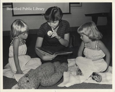 Library Staff Member Reads with Children at St. Paul Avenue Branch of the Brantford Public Library