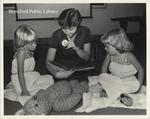 Library Staff Member Reads with Children at St. Paul Avenue Branch of the Brantford Public Library