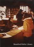 Staff and Patron at Registration Desk of the St. Paul Branch of the Brantford Public Library, Undated