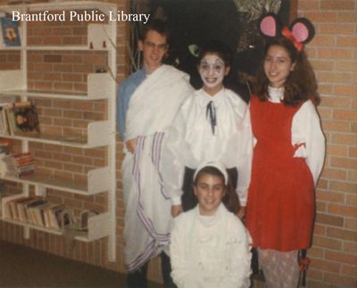 Four Youths Pose in Costume for a Halloween Picture at the St. Paul Avenue Branch of the Brantford Public Library, 1989