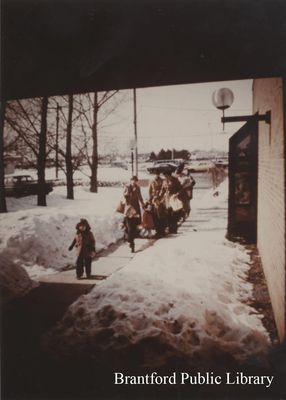 Staff Bring Line of Children Inside the St. Paul Avenue Branch of the Brantford Public Library, Winter, Undated