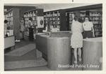 Black and White Image of Library Staff at Desk of the St. Paul Branch of the Brantford Public Library, Undated