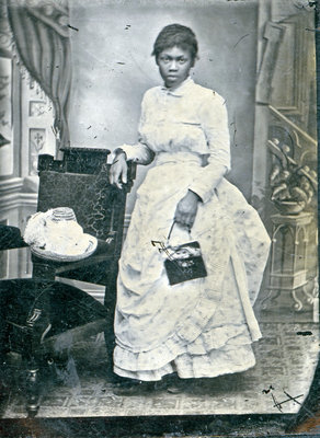 Tintype of Unidentified African American Woman Leaning on Chair [n.d.]