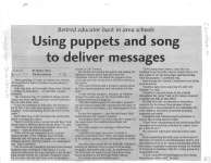 Using puppets and song to deliver messages