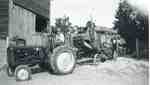Gordon Sherwood with Ford tractor and George White threshing machine, 1953
