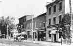 Brant Street, east side, with view of The Royal Bank of Canada and store fronts, same day in 1914