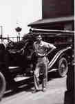 Tom Barnard with Burlington Fire Department truck, ca 1950