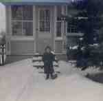 Steve Willey with a snow shovel in front of the entrance porch, 470 Brock Avenue, ca 1945