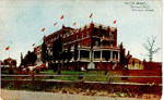 Hotel Brant, Burlington Beach, Burlington, Canada -- Exterior, east end with flags; postmarked May 18, 1910