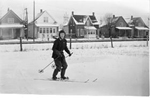 Art Brame Jr. skiing near the railway tracks at Brant Avenue (now Brock Avenue), 1959