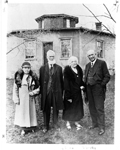 William and Barbara Pickett (centre) standing between Keitha (née Pickett) and George S. Henry in front of the Pickett Octagonal House, now 6103 Guelph Line, 1933