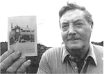 George Thorpe holding a photograph of the Thorpe family home on Maple Avenue