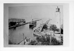 Burlington Bay Canal, showing the swing bridge, passenger boat, pier and lighthouse, ca  1910