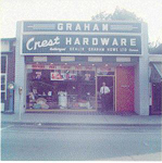 Crest Hardware, 383 Brant Street, owner Chris Graham standing at the door, 1960
