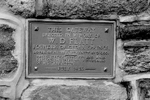 Plaque to W.D. Flatt on the memorial entrance gates to the Cedar Springs community, 1996