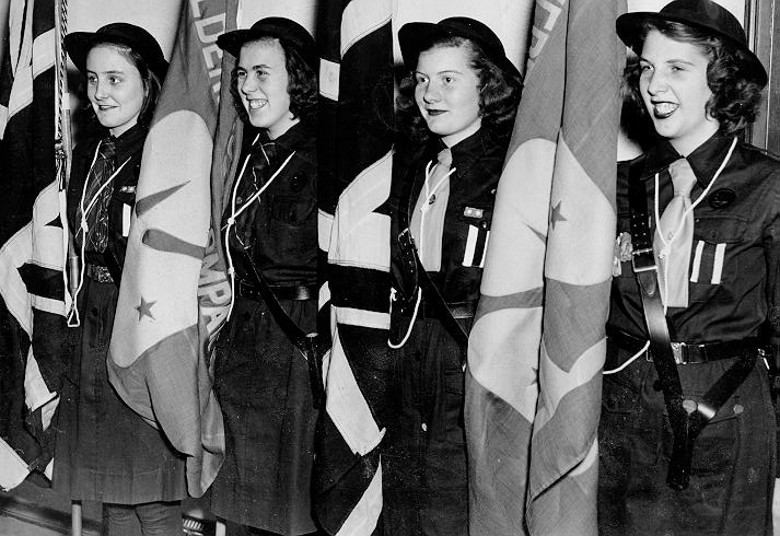 Girl Guides -- Girl Guide Colour Party at the Lady Baden-Powell Rally. L-R: Joy Johnson, Joyce Ellis, Sue Weber, Marion Stevenson