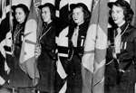 Girl Guides -- Girl Guide Colour Party at the Lady Baden-Powell Rally. L-R: Joy Johnson, Joyce Ellis, Sue Weber, Marion Stevenson