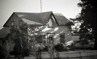 Cottage, white frame; Unknown Location