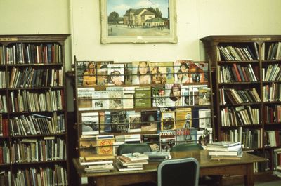 Interior of Carnegie library, magazines and painting of Lindsay Town Hall, 1975