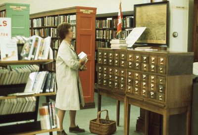 Interior of Carnegie library, fiction section and card catalogue, 1975