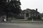 Exterior of Carnegie library, front view from street, including east side, 1973