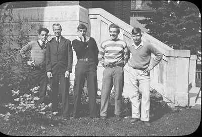 Portrait of a group of young men in front of Colborne High School