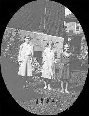 Portrait of three young women including Rosamond Hubble in front of Colborne High School