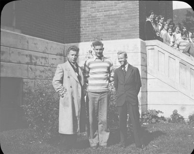 Portrait of Jack Armstrong (left), Bill Griffis (right) and another young man (centre) in front of Colborne High School