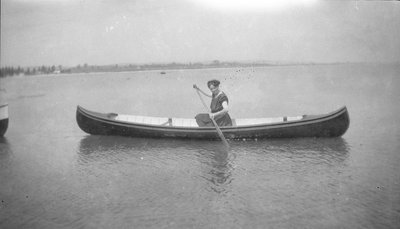 Woman paddling a canoe