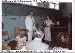 Norman O'Neill presenting a trophy to Melonie Chapin, Colborne High School Reunion, Colborne Arena, 1977