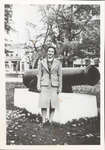 Photograph of Oni Rutherford (Myles) in front of the cannon, Victoria Square, Colborne