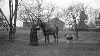 Unidentified woman with her horse and dog, Cramahe Township