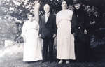 Reproduction photograph of Mrs. McCabe, George I. Merriman, Bertha (nee McCabe) Black, and Ella Jane (nee Merriman) Black