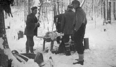 Deer hunters in a winter camp