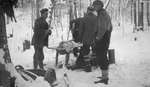 Deer hunters in a winter camp