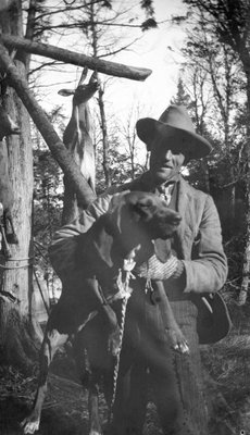 A deer hunter with his dog