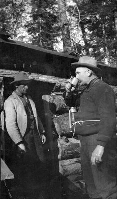 Deer hunters resting at their camp