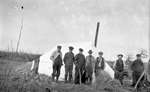 A group of hunters standing in front of a tent